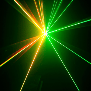 Red and green laser beams fanning out from one point in the dark